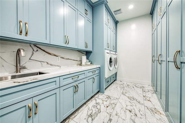 laundry area featuring visible vents, a sink, cabinet space, marble finish floor, and separate washer and dryer