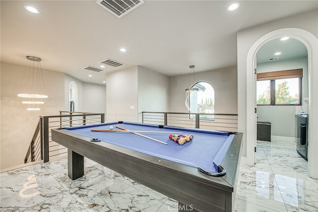 game room with visible vents, a notable chandelier, and marble finish floor