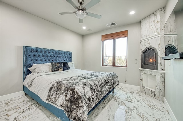 bedroom featuring recessed lighting, visible vents, baseboards, and a premium fireplace