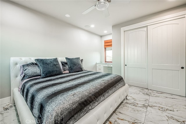 bedroom with a ceiling fan, baseboards, recessed lighting, a closet, and marble finish floor