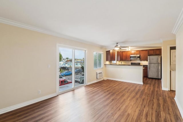 unfurnished living room with a ceiling fan, dark wood-type flooring, baseboards, and ornamental molding