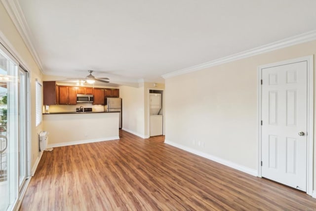 unfurnished living room with wood finished floors, a ceiling fan, and ornamental molding