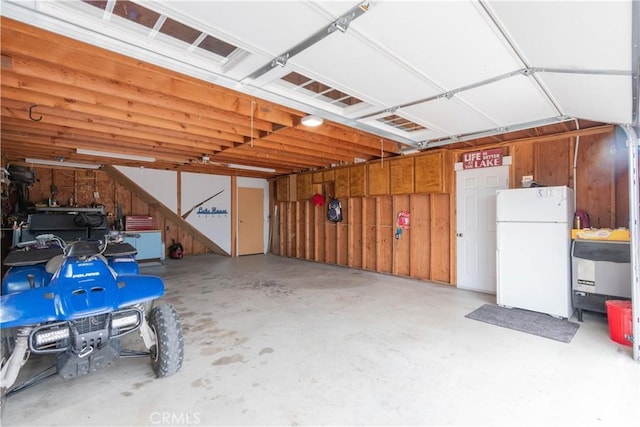 garage with freestanding refrigerator