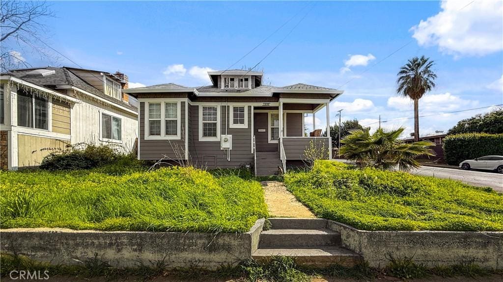 bungalow-style home featuring covered porch