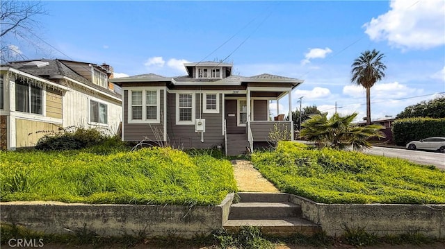 bungalow-style home featuring covered porch