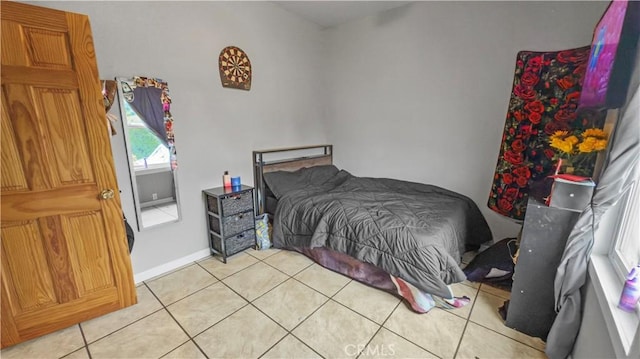bedroom with light tile patterned flooring