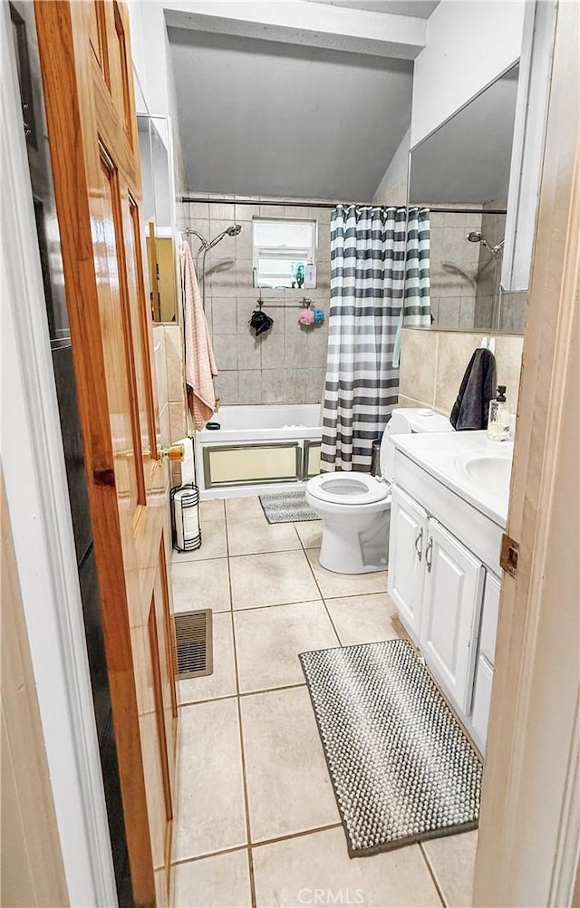 full bathroom with toilet, shower / bath combo with shower curtain, visible vents, tile patterned flooring, and vanity