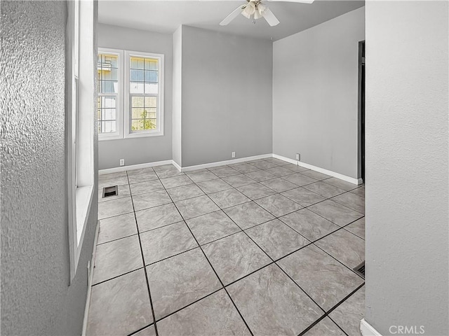 1685 Washington Ave, Oroville, CA 95966 - tiled spare room featuring a ceiling fan and baseboards