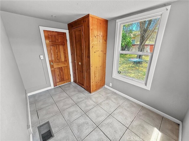 1685 Washington Ave, Oroville, CA 95966 - foyer with light tile patterned flooring and baseboards