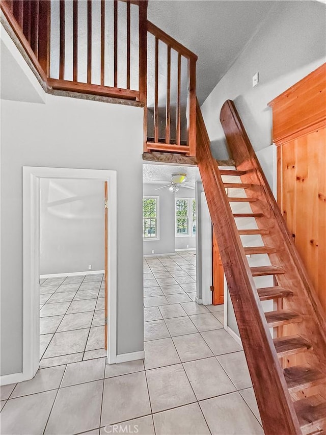 1685 Washington Ave, Oroville, CA 95966 - staircase with tile patterned floors, ceiling fan, and baseboards