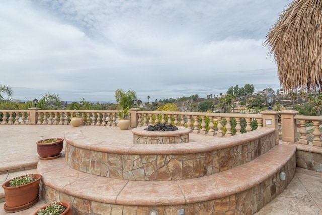 view of home's community with an outdoor fire pit