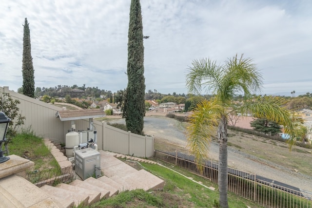 view of yard featuring a patio area and a fenced backyard