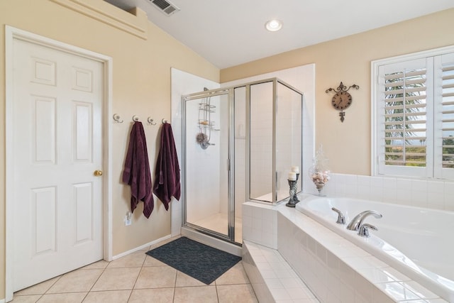 bathroom featuring tile patterned floors, visible vents, a shower stall, and a garden tub