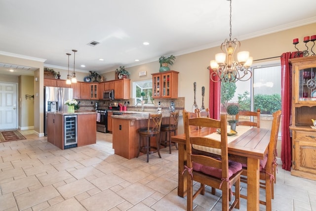 dining room with crown molding, wine cooler, visible vents, and a chandelier