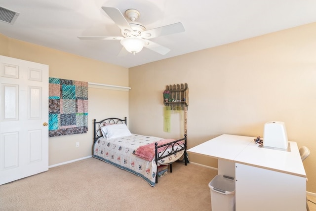 bedroom with visible vents, baseboards, light colored carpet, and ceiling fan