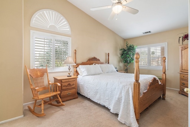 bedroom featuring vaulted ceiling, baseboards, visible vents, and light carpet