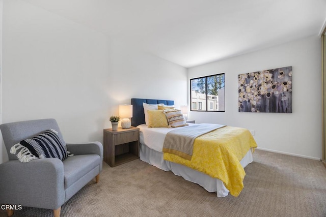 bedroom featuring baseboards and carpet floors