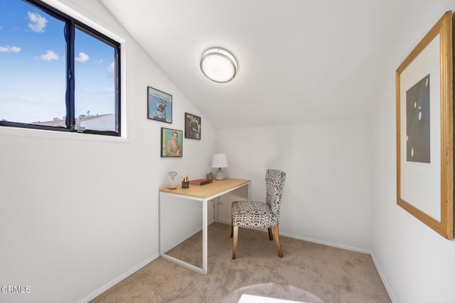 home office featuring electric panel, lofted ceiling, carpet flooring, and baseboards