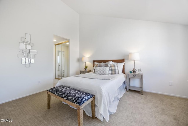 bedroom featuring carpet, baseboards, and a towering ceiling