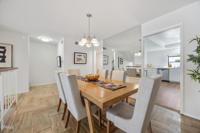 dining room featuring baseboards and an inviting chandelier