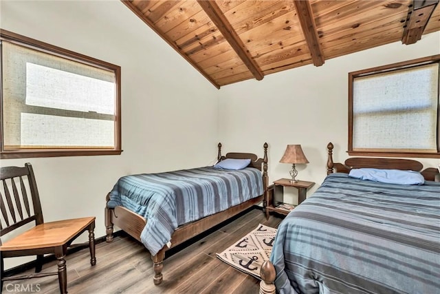 bedroom with lofted ceiling with beams, wood finished floors, wood ceiling, and baseboards