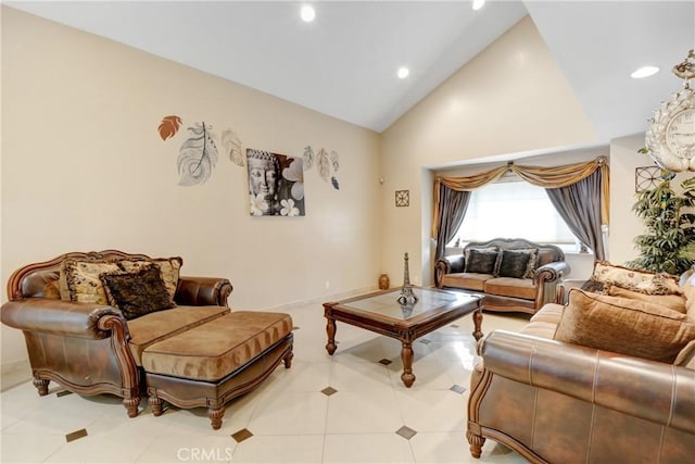 sitting room with recessed lighting and high vaulted ceiling