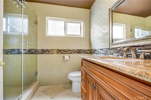 full bathroom with tile patterned floors, a shower stall, toilet, and vanity