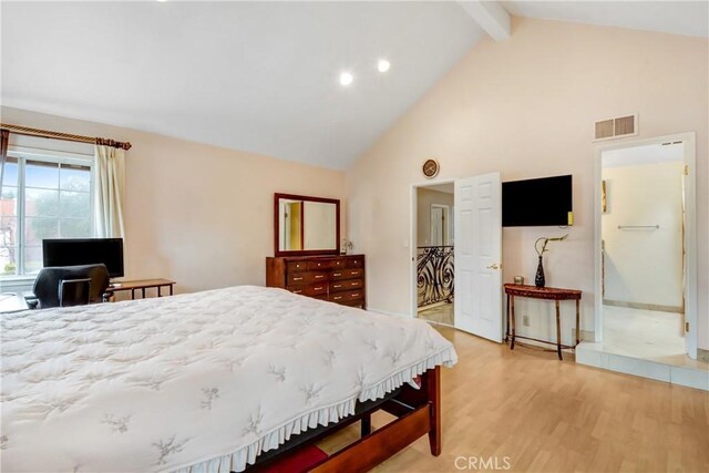 bedroom featuring light wood-type flooring, beamed ceiling, high vaulted ceiling, and visible vents