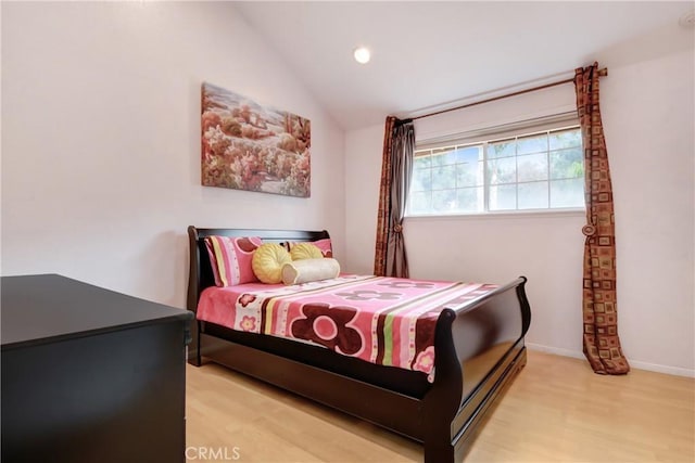 bedroom featuring recessed lighting, baseboards, light wood-style floors, and lofted ceiling