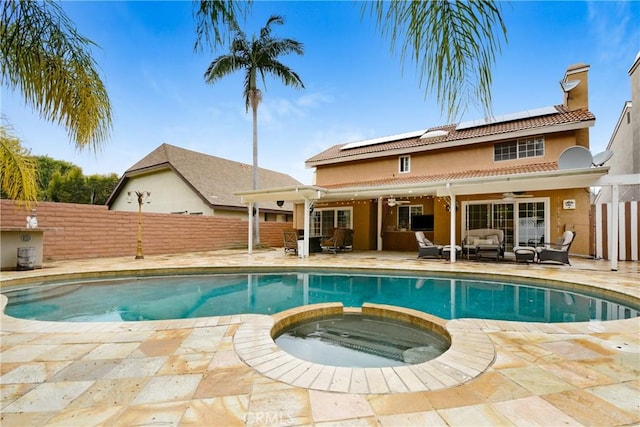 view of swimming pool featuring a patio, an outdoor hangout area, a fenced backyard, and ceiling fan