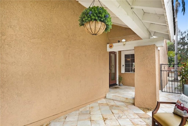 view of patio with a gate