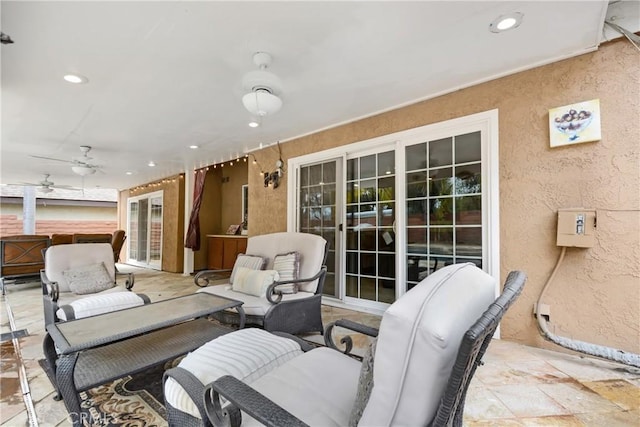 view of patio with an outdoor hangout area and a ceiling fan