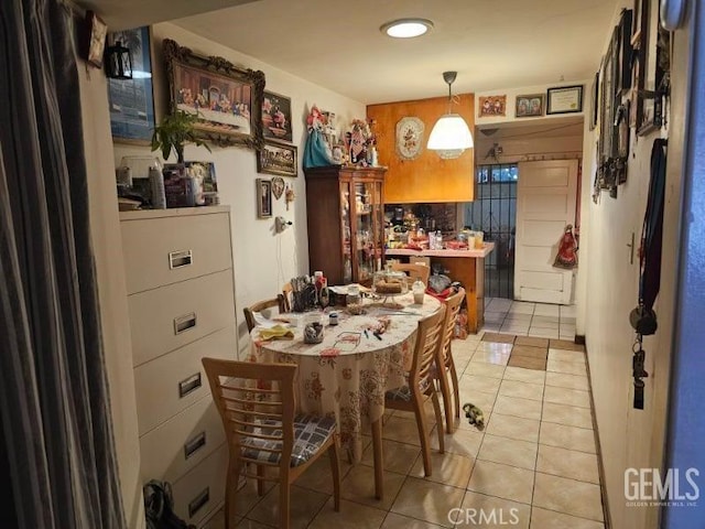 dining space with light tile patterned floors