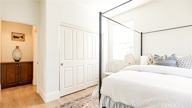 bedroom with a closet and light wood-style floors