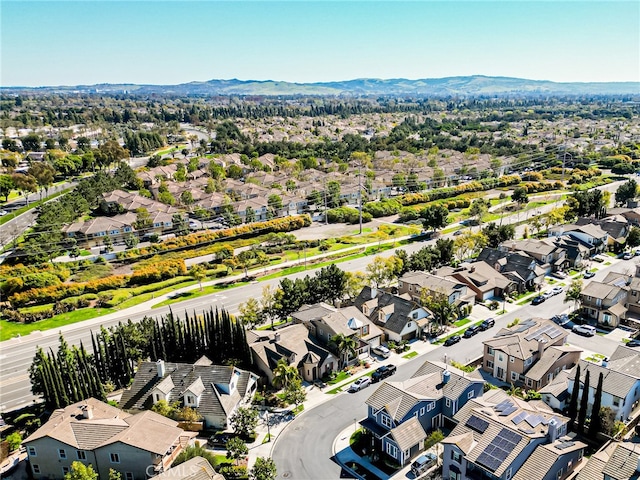 birds eye view of property featuring a mountain view and a residential view