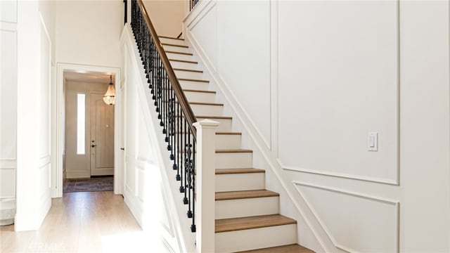 stairway featuring wood finished floors