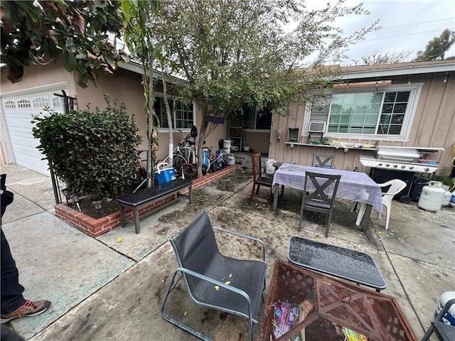 view of patio with grilling area and outdoor dining space