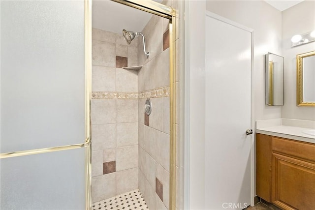 bathroom featuring vanity and a stall shower