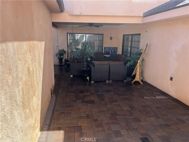 view of patio with an outdoor hangout area and ceiling fan