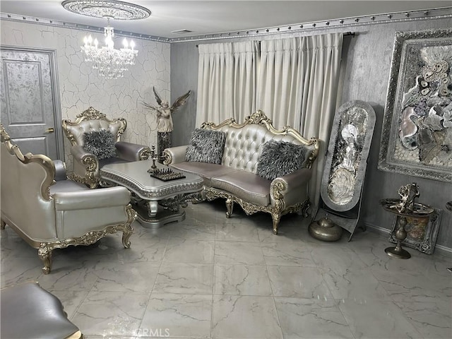 sitting room featuring marble finish floor and an inviting chandelier