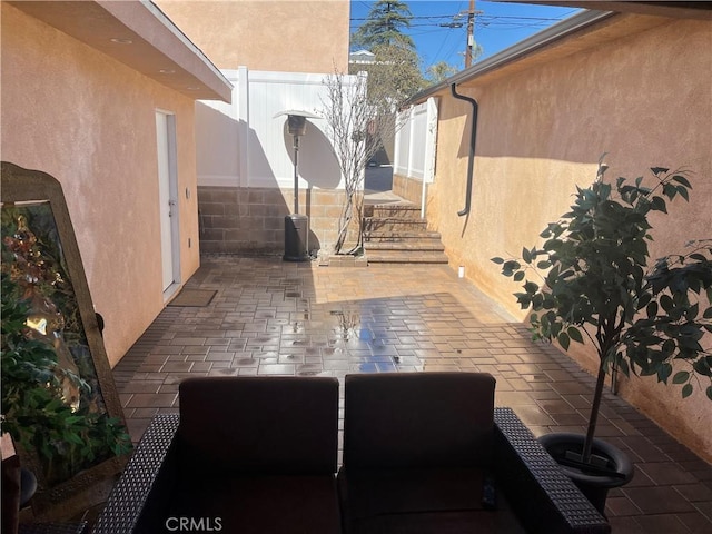 view of patio / terrace featuring fence