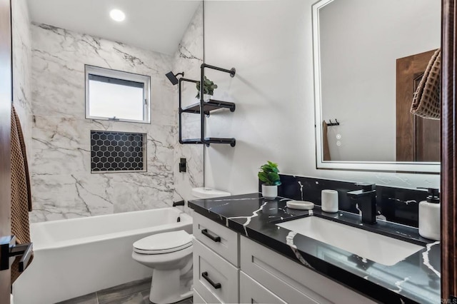 full bath featuring vanity, toilet, and shower / bathtub combination