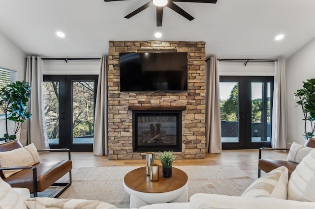 living room featuring recessed lighting, french doors, ceiling fan, and wood finished floors