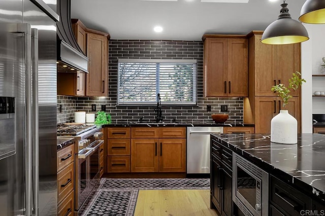 1326 Farmer Rd, Julian, CA 92036 - kitchen featuring premium appliances, tasteful backsplash, brown cabinets, and a sink