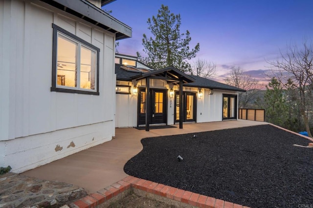 1326 Farmer Rd, Julian, CA 92036 - exterior entry at dusk with a patio area