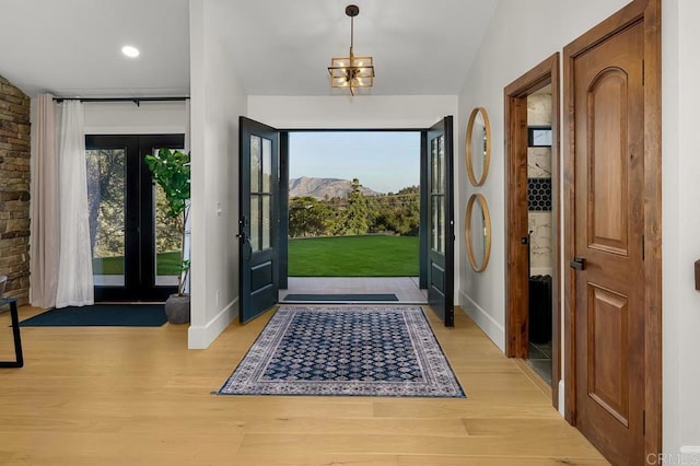 1326 Farmer Rd, Julian, CA 92036 - entrance foyer with an inviting chandelier, a mountain view, light wood-type flooring, and baseboards