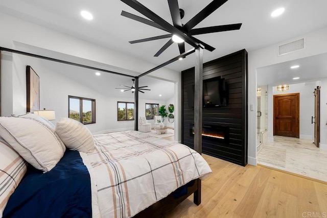 1326 Farmer Rd, Julian, CA 92036 - bedroom featuring recessed lighting, visible vents, a large fireplace, and light wood-style flooring