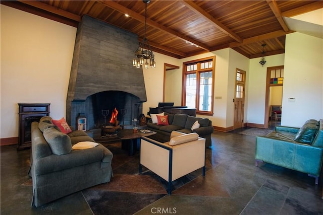 living area featuring baseboards, beam ceiling, an inviting chandelier, and wooden ceiling