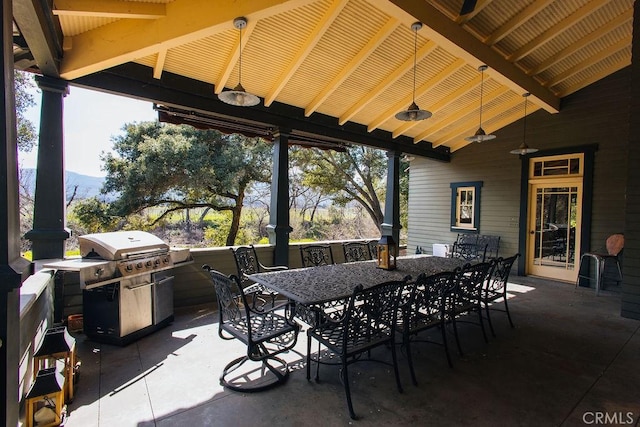 view of patio / terrace featuring area for grilling and outdoor dining area