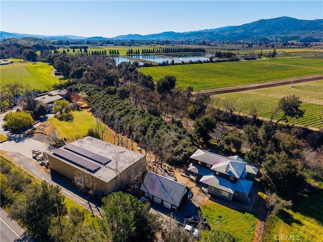 bird's eye view featuring a rural view and a water and mountain view